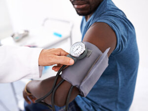 male patient at doctor getting tested for high blood pressure | metabolic syndrome